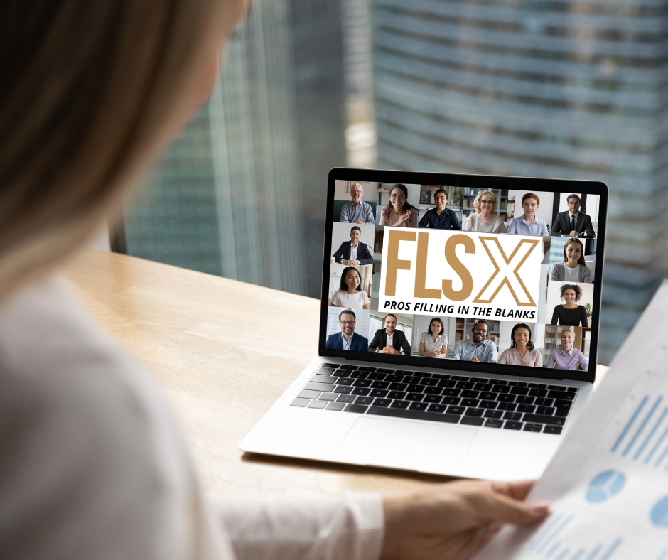 Person sitting at a desk looking at a laptop screen displaying a video conference grid with multiple participants and the text “FLS X – Pros Filling in the Blanks.”